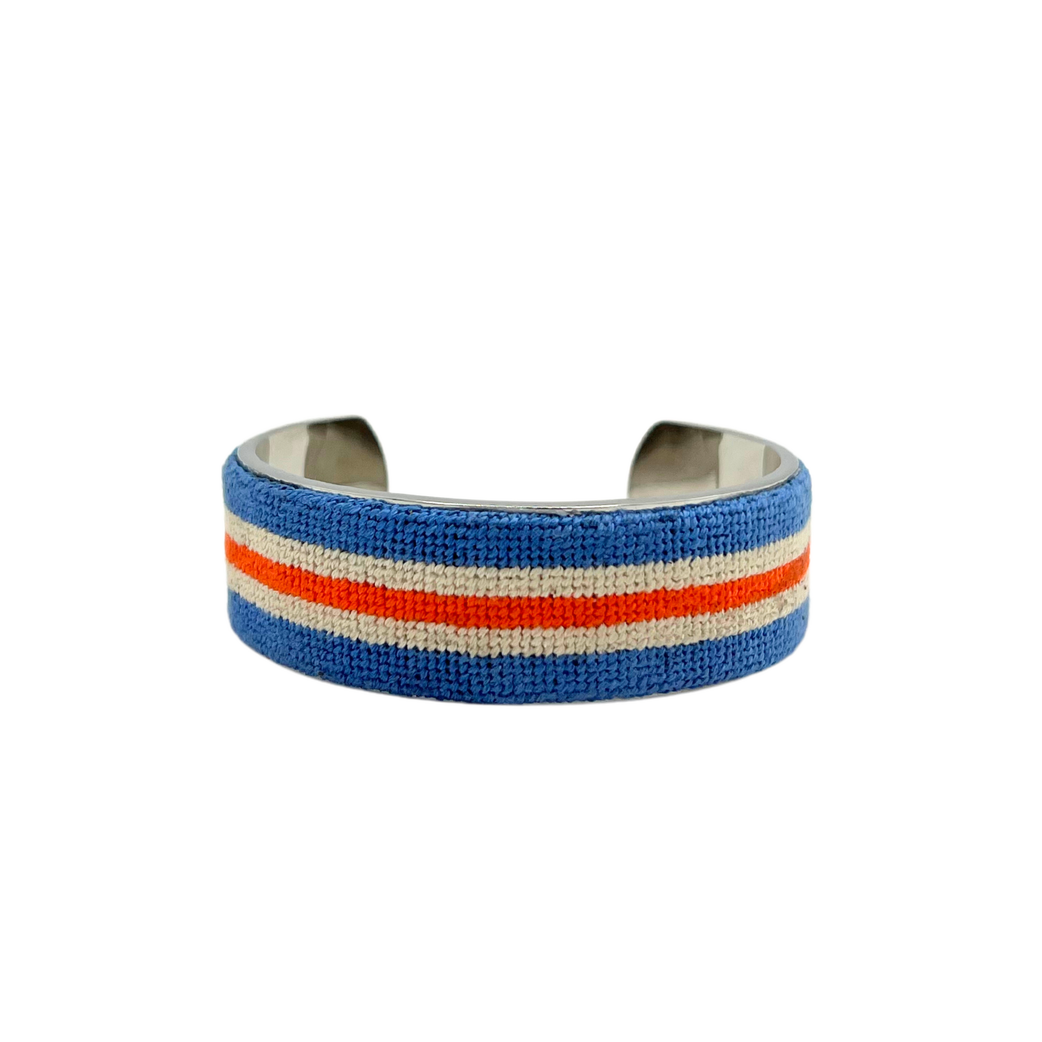 red, white, and blue striped needlepoint cuff over metal