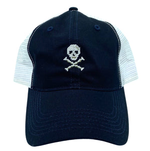 skull and crossbones on midnight blue trucker hat