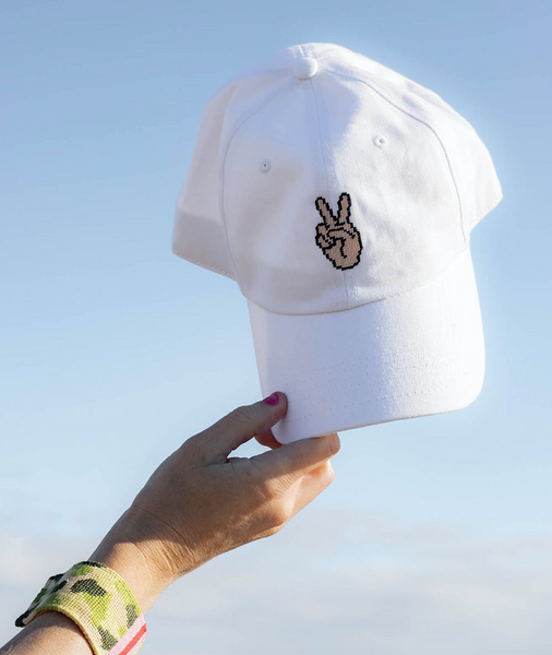 peace sign on snow white hat